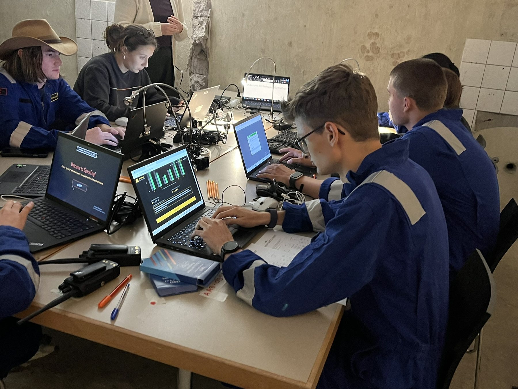 Asclepios VI astronauts at work inside the base