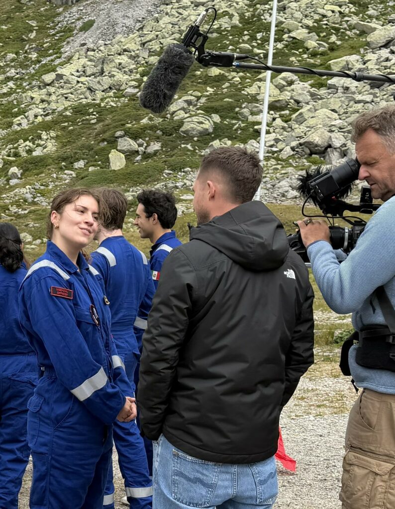 A film crew interviewing an Asclepios officer at the mission site